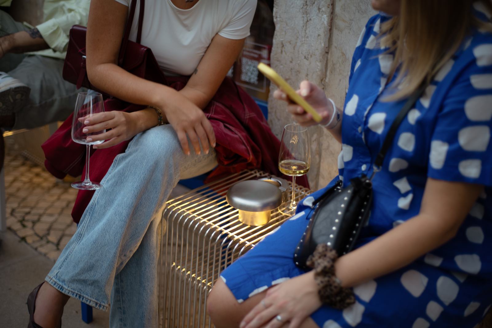 Guests with glasses outside Levö Bar on the opening night